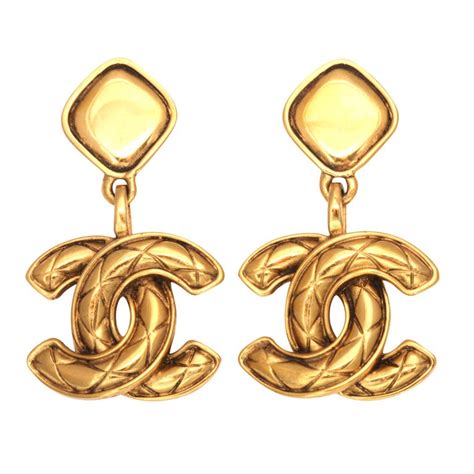 chanel quilted style dangle earrings.